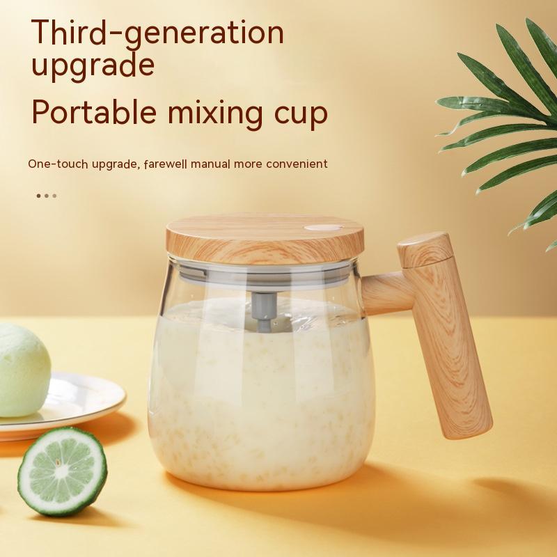 Self stirring coffee mug with a modern design, featuring a wooden lid and handle for effortless mixing convenience.