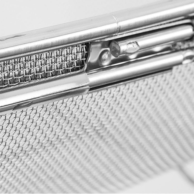 Close-up of the fine mesh basket of an over-sink stainless steel drain rack for easy food draining.