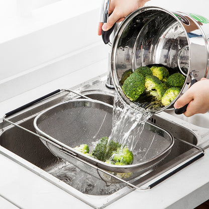 over-sink stainless steel drain rack in use, rinsing broccoli above sink for easy drainage