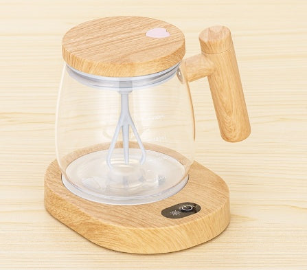 Self stirring coffee mug with innovative design featuring a wooden lid and handle for effortless beverage mixing.