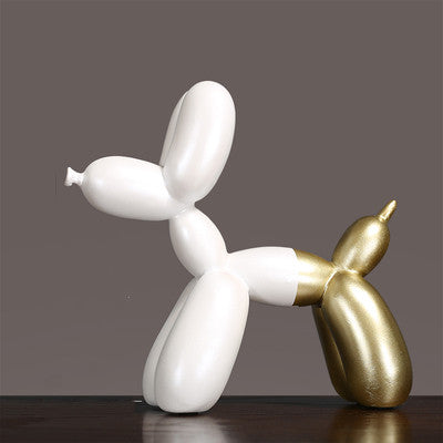 Luxury Decorative Wall Light and cut sculpture resembling a balloon dog in gold and white colors.