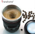 Camera lens self stirring mug showing swirling coffee with coffee beans around it.