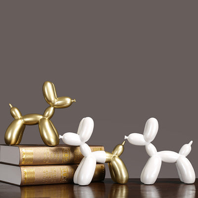 Luxury Decorative Wall Light and cut featuring stylish decorative balloon dog sculptures in gold and white.