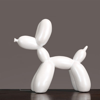 White decorative balloon dog sculpture, adding a playful touch to modern interiors.