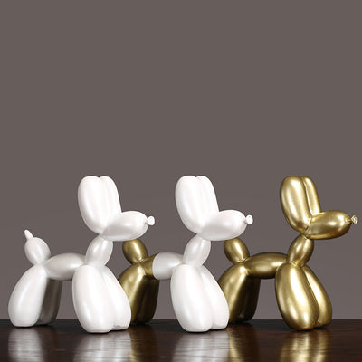 Luxury Decorative Wall Light and cut balloon dog sculptures in white and gold, adding elegance to any decor.