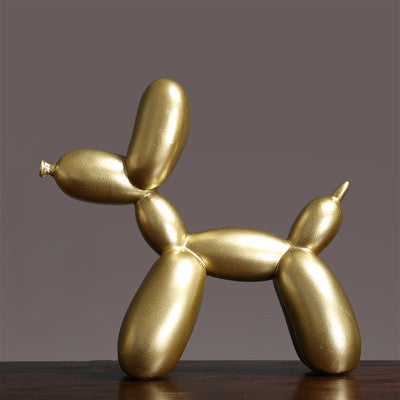 Gold balloon dog sculpture with a polished finish, perfect for modern home decor.