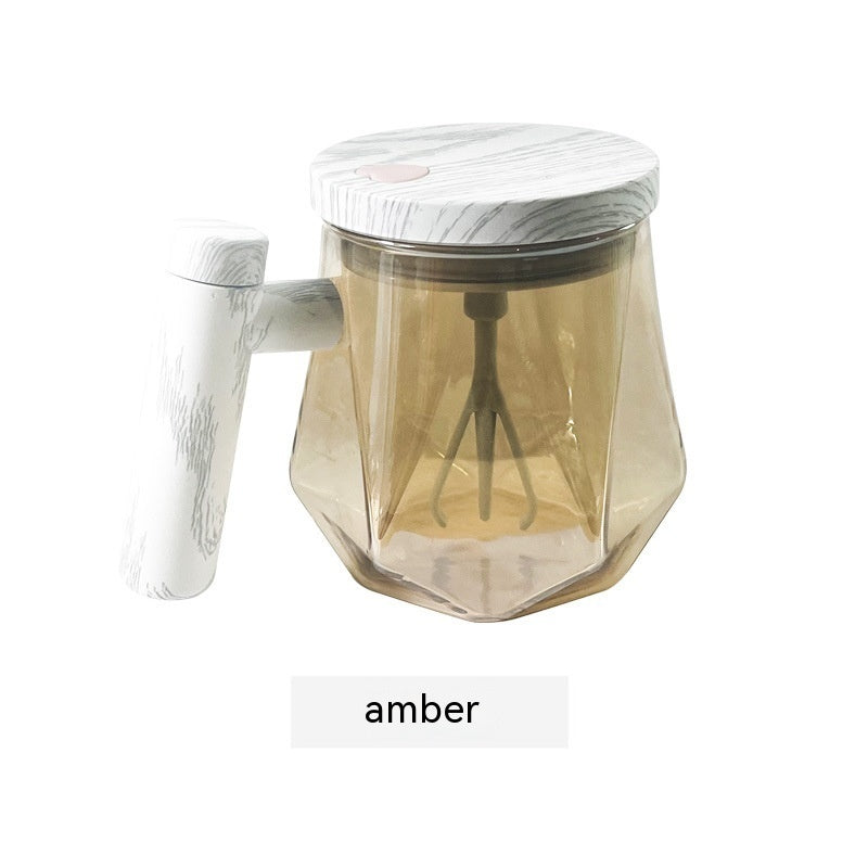 Portable self-stirring coffee mug in amber with a built-in whisk for effortless mixing.