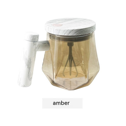 Portable self-stirring coffee mug in amber with a built-in whisk for effortless mixing.